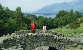 Couple on stone bridge