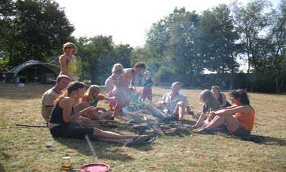 Family around campfire