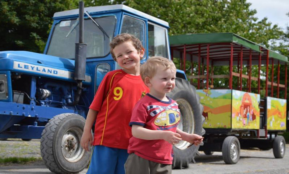 Happy children and tractor ride