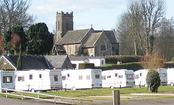 Caravans with church behind