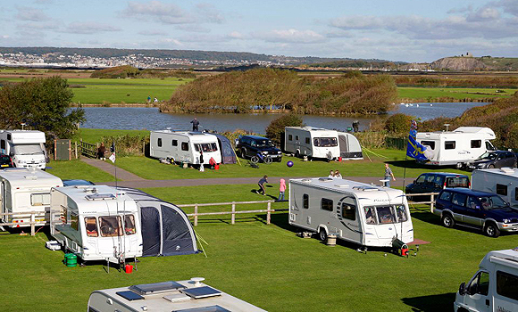 Touring pitches beside lake