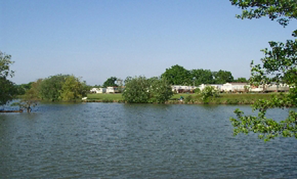 Touring pitches beside lake